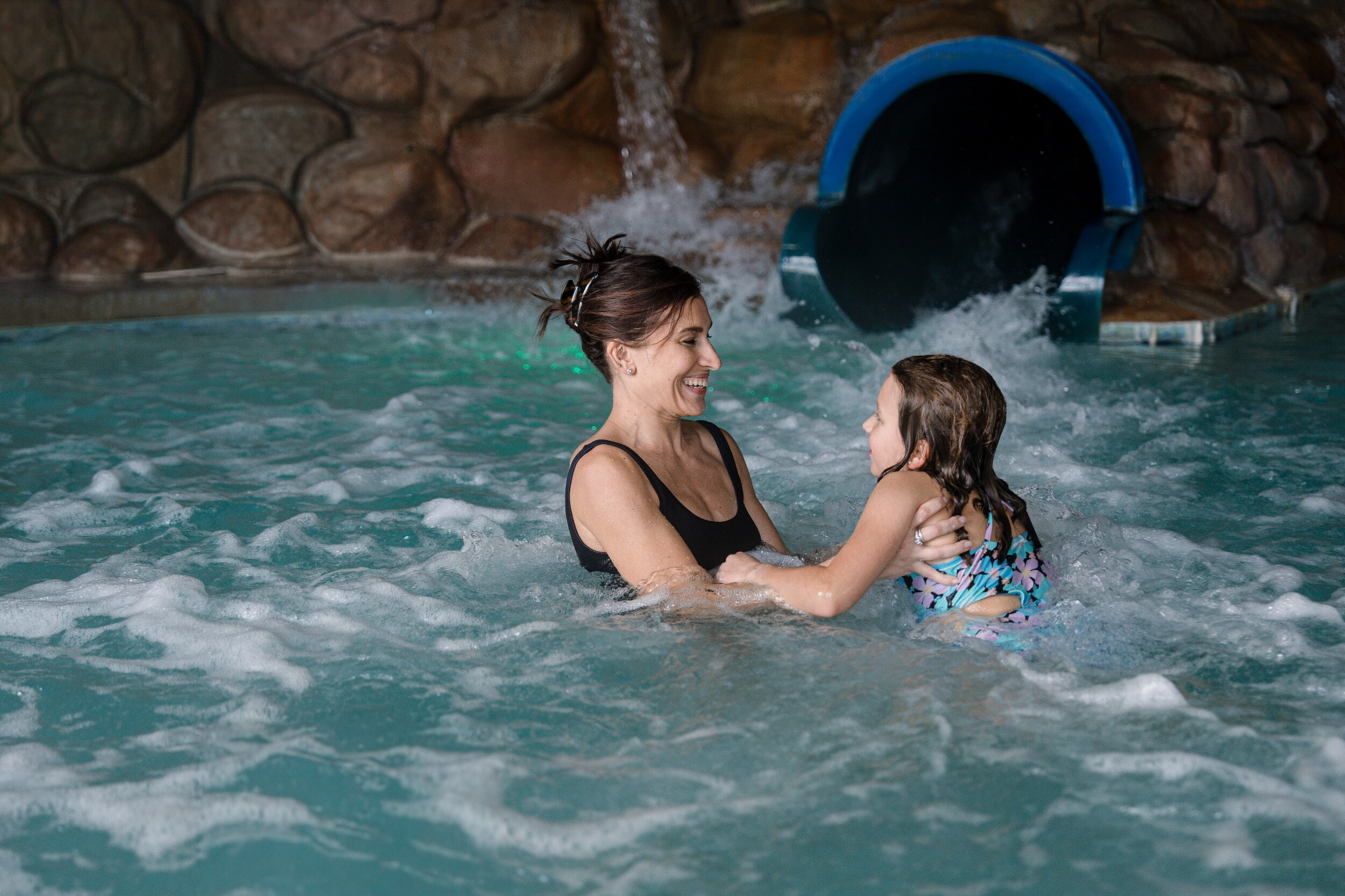 A mother and child enjoy the Pilgrim Cover theme pool at at the John Carver Inn and Spa in Plymouth MA