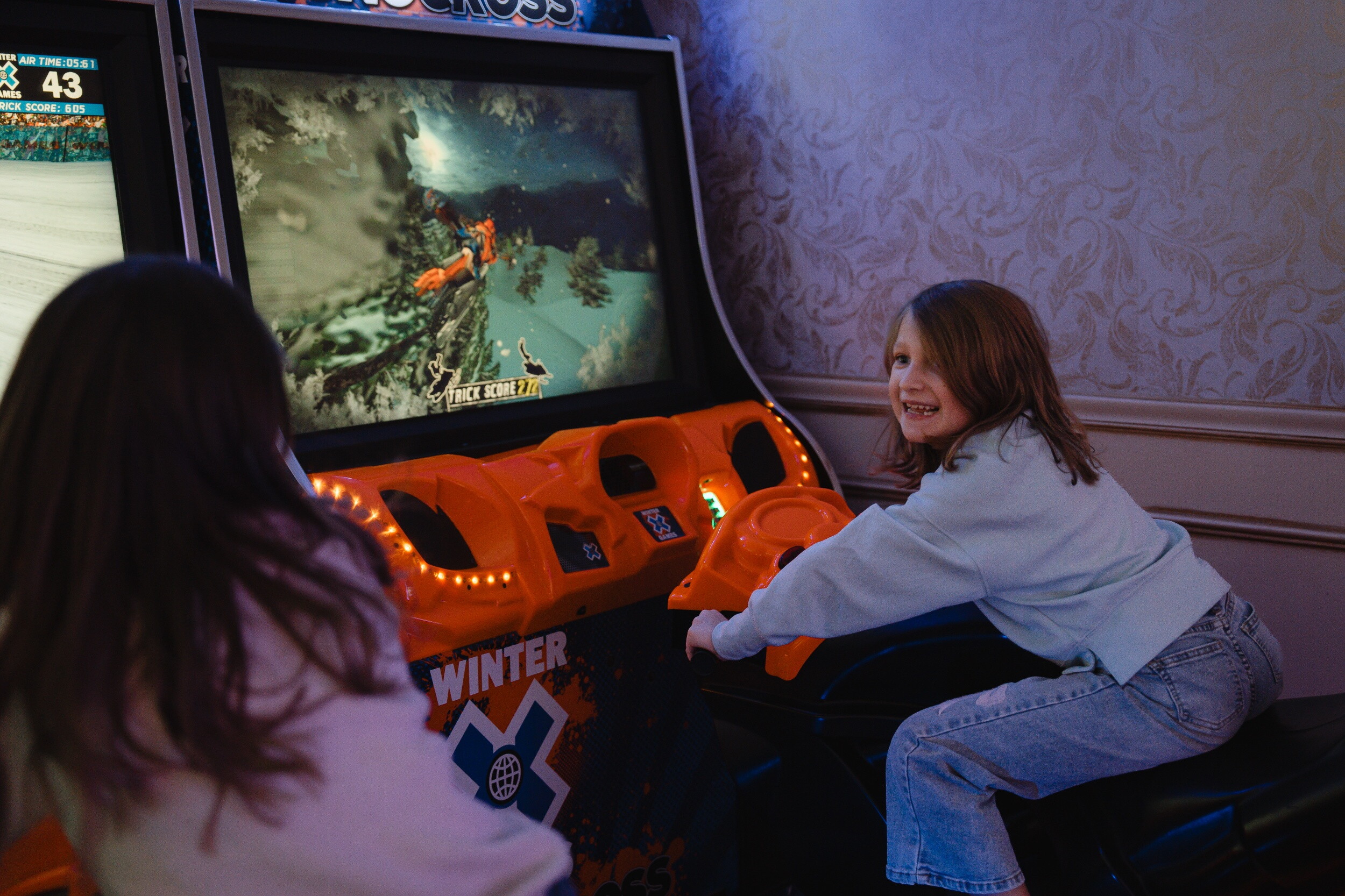 A child enjoys the arcade at the John Carver Inn and Spa in Plymouth MA
