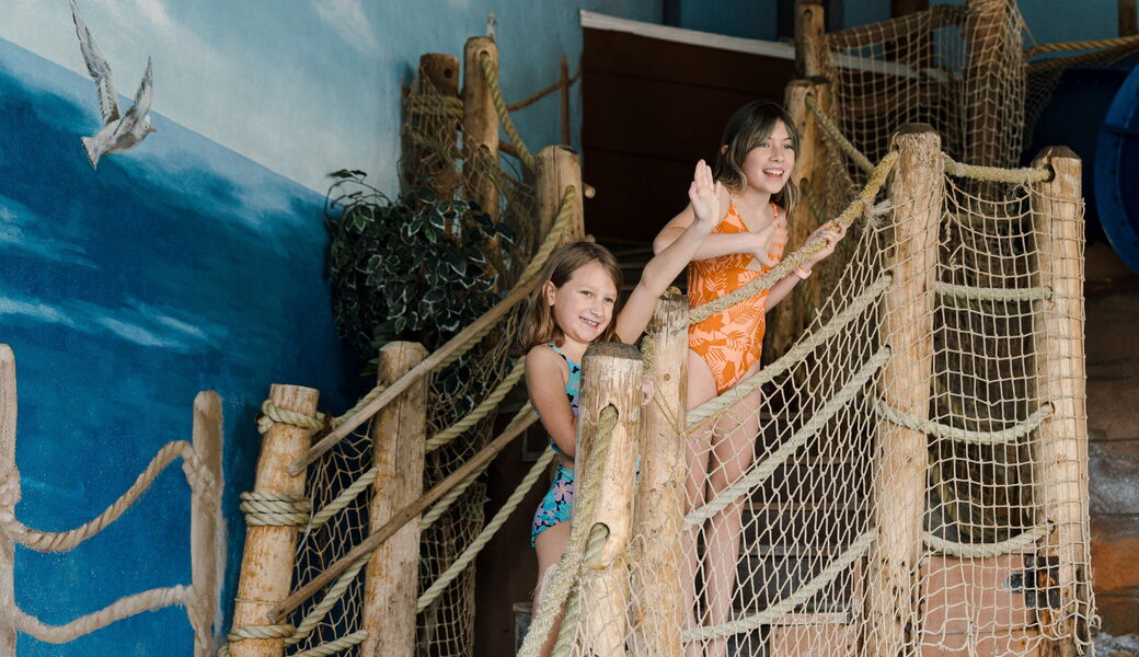 Two children enjoy the Pilgrim Cover theme pool at the John Carver Inn and Spa in Plymouth MA