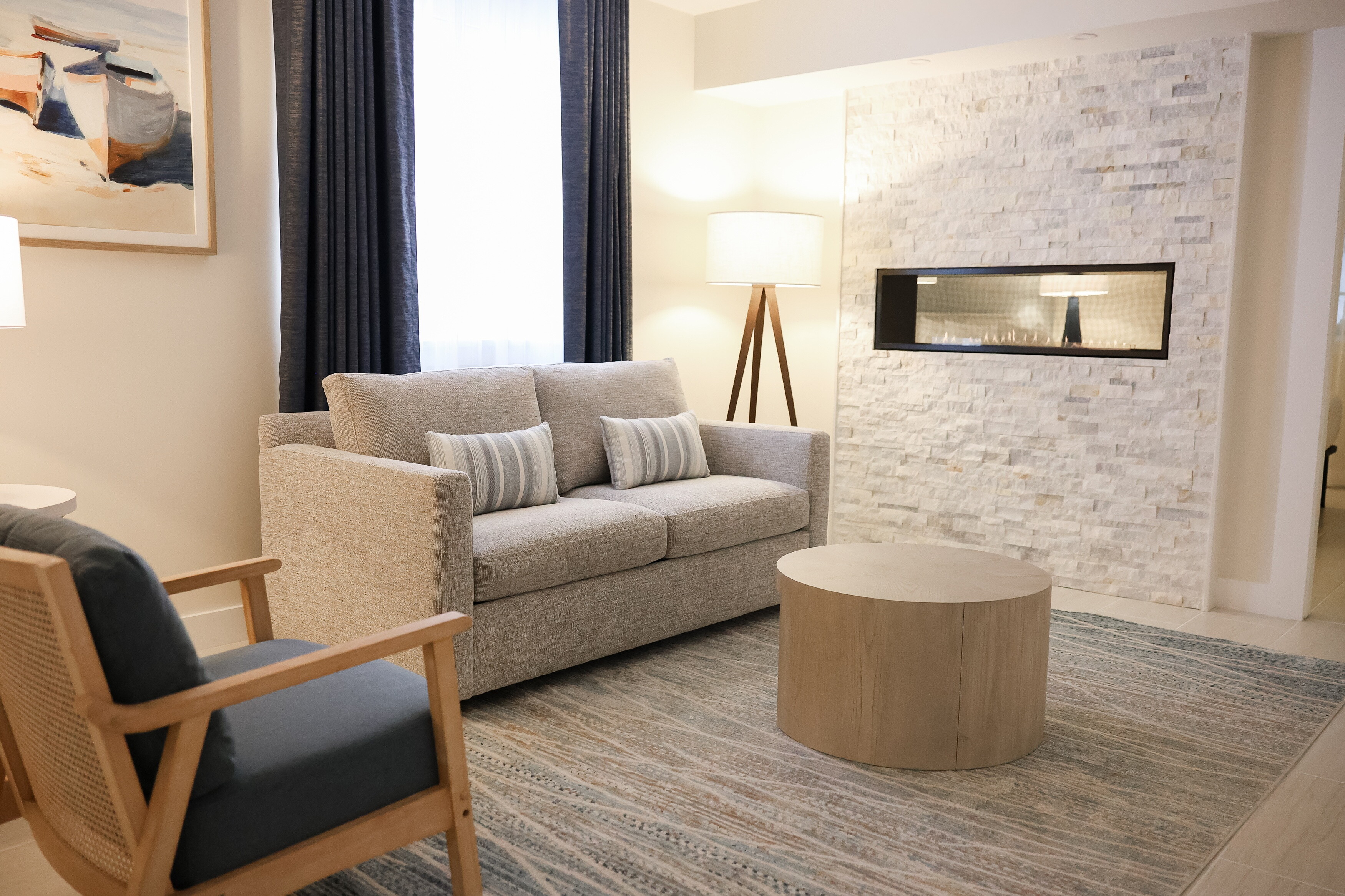 A living room area in the fireplace suite at the John Carver Inn & Spa in Plymouth MA