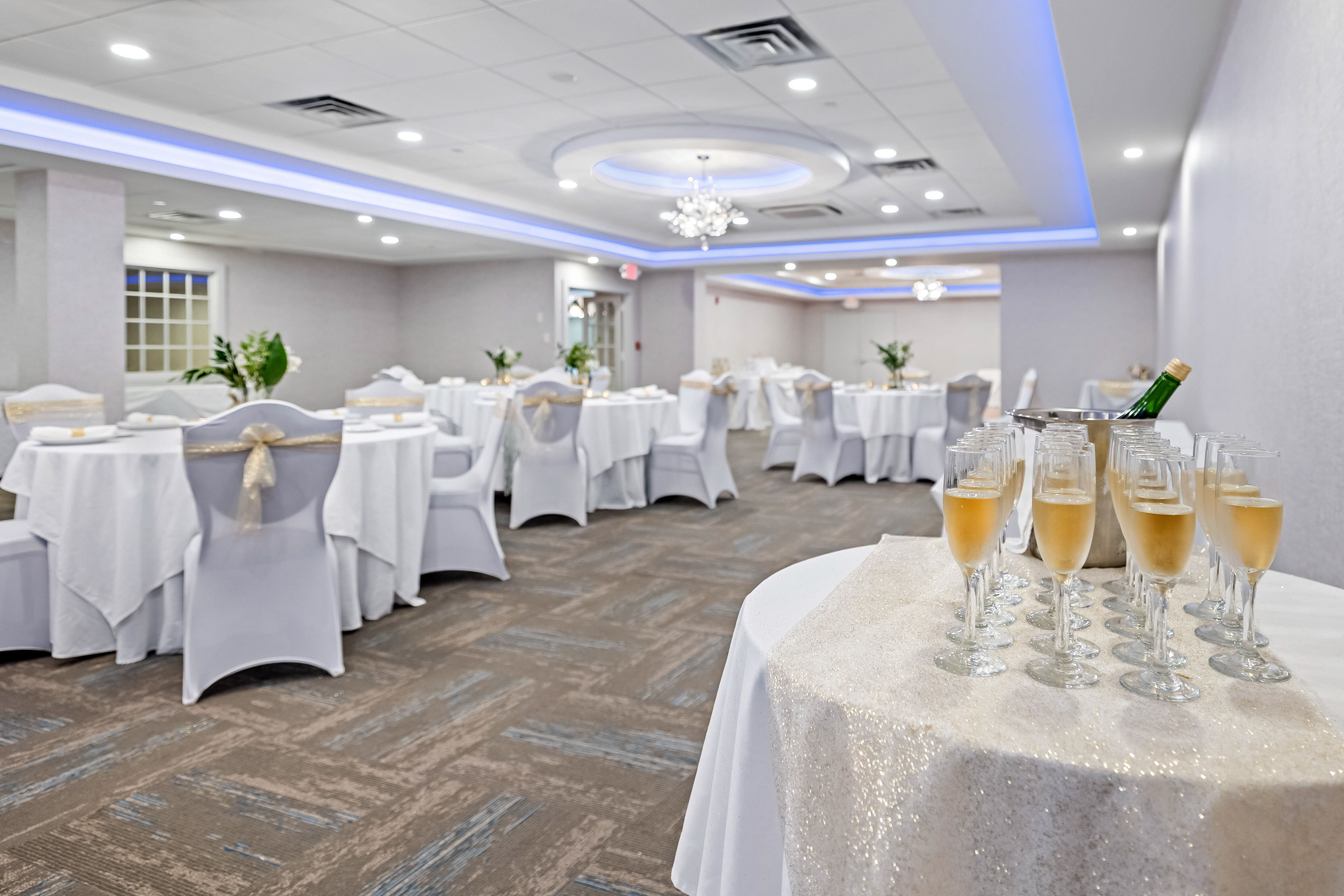 Banquets and Events at the John Carver Inn & Spa - A fully set event room with champagne flutes